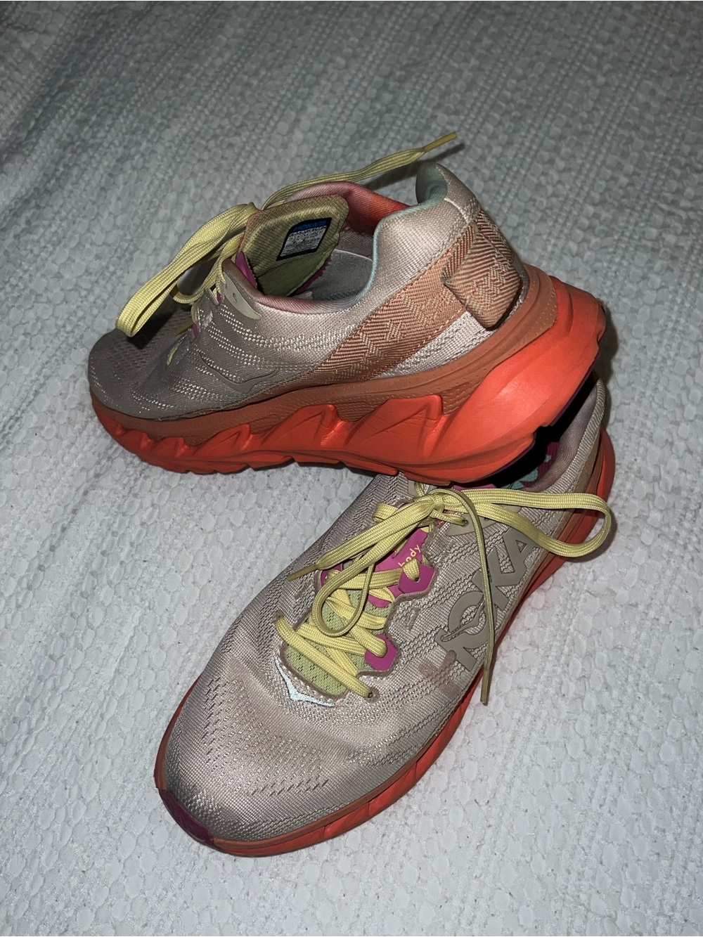 Hoka Peach Knit Athletic Shoes with Orange Midsole and Yellow Laces